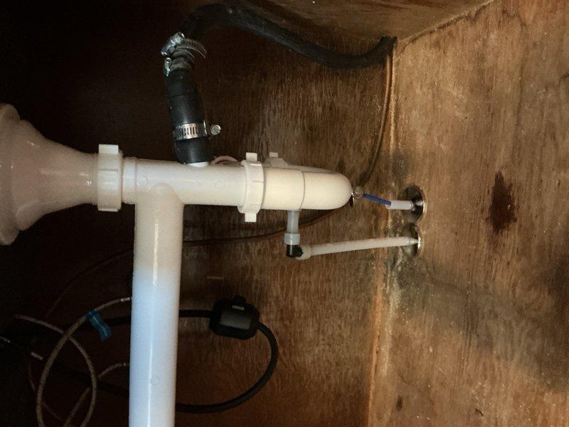 Completed installation of customer-supplied toilet with new angle stop valve in bathroom. Installed two customer-supplied sinks including vanity unit with associated drain assemblies and supply connections. Installed customer-supplied kitchen faucet and ran ice maker supply line to refrigerator location. Installed ball valve for outdoor faucet above water heater location, with valve sized up to 1 inch. Removed and hauled away existing toilet, sinks, and vanity as requested. All fixtures tested for proper operation and checked for leaks upon completion.