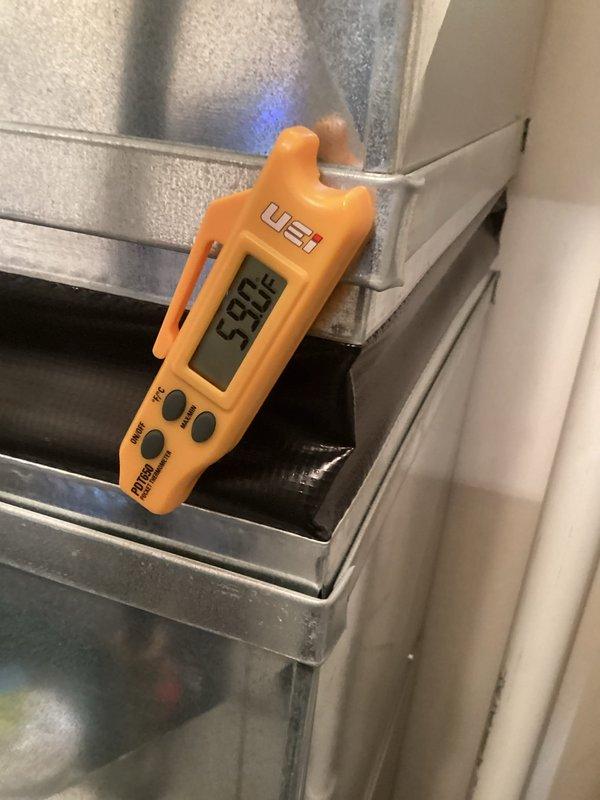 Completed annual AC tune-up and inspection on residential cooling system. Unit operating properly with supply air temperature measuring 53.9°F, electrical connections secure and within specifications, and condenser coils clean with adequate airflow through outdoor unit.