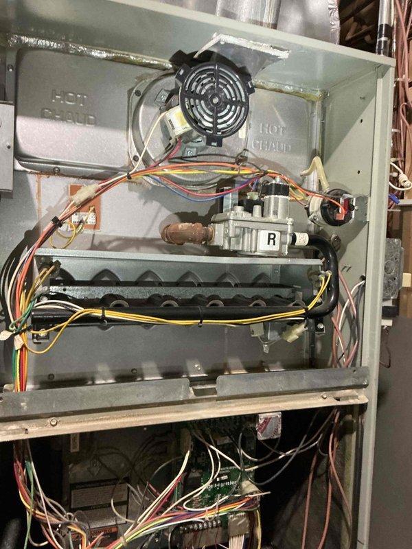 Completed annual cooling maintenance on 16-year-old TRANE air conditioning system. Performed comprehensive inspection of all major components including capacitor, contactor, and control board—all found to be in good working condition. Verified refrigerant charge within manufacturer specifications. Measured temperature drop across evaporator coil at 19°, which is within acceptable range. Confirmed evaporator coil is clean and filters are in good condition.

Identified several concerns during inspection: condenser coil shows dirt accumulation but presents cleaning challenges due to accessibility issues; compressor exhibiting abnormal sounds indicating potential wear; heat exchanger showing signs of deterioration with holes forming at burner ports. Documented findings with photographs of outdoor condenser unit and internal furnace components including heat exchanger condition. Reviewed all available options with customer and scheduled follow-up consultation with service advisor to discuss