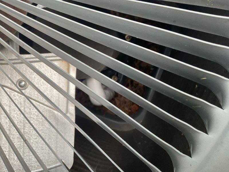 Responded to no cooling callback on 11-year-old R-410A system that had refrigerant and UV dye added approximately one month prior. Found suction line frozen solid from evaporator outlet to compressor, indicating system is low on refrigerant again due to active leak. Shut down outdoor unit to prevent compressor damage and left indoor blower running to thaw evaporator coil. Contacted property owner by phone to explain situation. Previous refrigerant addition was temporary measure to restore operation and facilitate leak detection with UV dye. Recommended completing leak search using installed dye, repairing identified leak, evacuating system, and recharging to factory specifications, or replacing aging system.