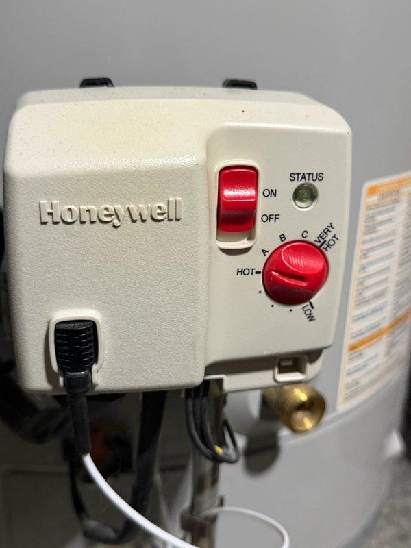Responded to no hot water complaint on 15-year-old Bradford White 40-gallon gas water heater. Upon arrival, diagnosed tripped electrical outlet supplying power to the gas control valve. Reset the outlet, restored power to the unit, and ran hot water to verify proper operation. Water heater ignited and fired successfully. Inspected Honeywell gas control valve and burner assembly during testing. Provided estimate for preventive maintenance including burner assembly cleaning and thermocouple replacement due to age of unit.