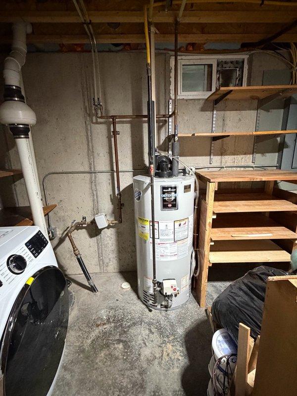 Responded to no hot water complaint on 15-year-old Bradford White 40-gallon gas water heater. Upon arrival, diagnosed tripped electrical outlet supplying power to the gas control valve. Reset the outlet, restored power to the unit, and ran hot water to verify proper operation. Water heater ignited and fired successfully. Inspected Honeywell gas control valve and burner assembly during testing. Provided estimate for preventive maintenance including burner assembly cleaning and thermocouple replacement due to age of unit.