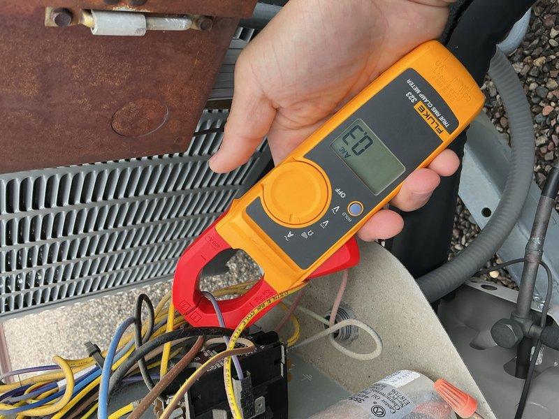 Performed comprehensive AC tune-up on 9-year-old rooftop unit. Accessed rooftop system with key obtained from front desk. Inspected and verified 20x20x1 air filter in good condition, confirmed proper blower speed and clean evaporator coils. Conducted electrical diagnostics on rooftop condenser unit using digital multimeter, testing capacitor functionality, contactor operation, and all electrical connections. Verified refrigerant charge levels within manufacturer specifications. All system components found operating within normal parameters with no deficiencies noted. Unit confirmed ready for continued summer operation.