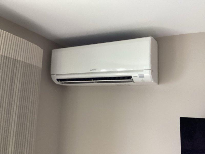 Completed annual cooling tune-up on Mitsubishi Electric mini-split system with one outdoor condenser unit and four indoor air handler heads. Performed comprehensive maintenance including filter cleaning on all heads, drain line flushing, and temperature split verification testing both individually and with all heads operating simultaneously. All heads achieved optimal 25-degree temperature splits, confirming proper system performance. Noted that the master bedroom head will require deep cleaning during next year's scheduled maintenance visit.