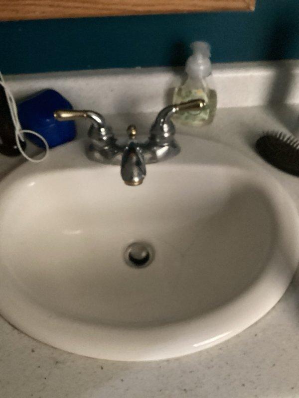 Completed comprehensive plumbing inspection as part of friends and family service program. Inspected all accessible plumbing fixtures and components including bathroom sink with dual-handle chrome faucet, water heater supply valves with braided flex lines, and shut-off valve assemblies. All fixtures confirmed operational with no leaks, drainage issues, or functional concerns reported. Minor surface corrosion noted on valve mounting hardware but does not affect operation. All systems verified in proper working order with no immediate repairs required.