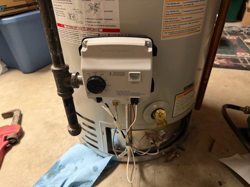 Responded to service call for water heater repair. Diagnosed faulty gas valve on residential water heater unit. Removed existing Honeywell gas control valve and thermostat assembly. Installed new replacement gas valve with integrated temperature control featuring ON/OFF rocker switch and adjustable temperature dial ranging from HOT to VERY HOT settings. Verified proper gas connections, tested control functionality, and confirmed operational status indicator. Unit restored to full working condition with proper temperature regulation capability.