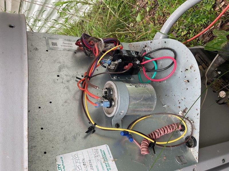 Responded to a no-cool condition on a 3-year-old residential air conditioning system. Upon arrival, found the outdoor unit running but the condenser fan motor not operating, resulting in hot air discharge from the indoor unit. Diagnosed a failed run capacitor that had overheated to 155°F and a condenser coil heavily blocked with cottonwood debris restricting airflow, which caused the fan motor to overheat to 178°F. Replaced the defective capacitor with new unit and thoroughly cleaned the condenser coil to restore proper airflow. Restarted the system and verified normal operation with condenser fan running properly and a 22°F temperature split across the evaporator coil. System restored to full cooling capacity.