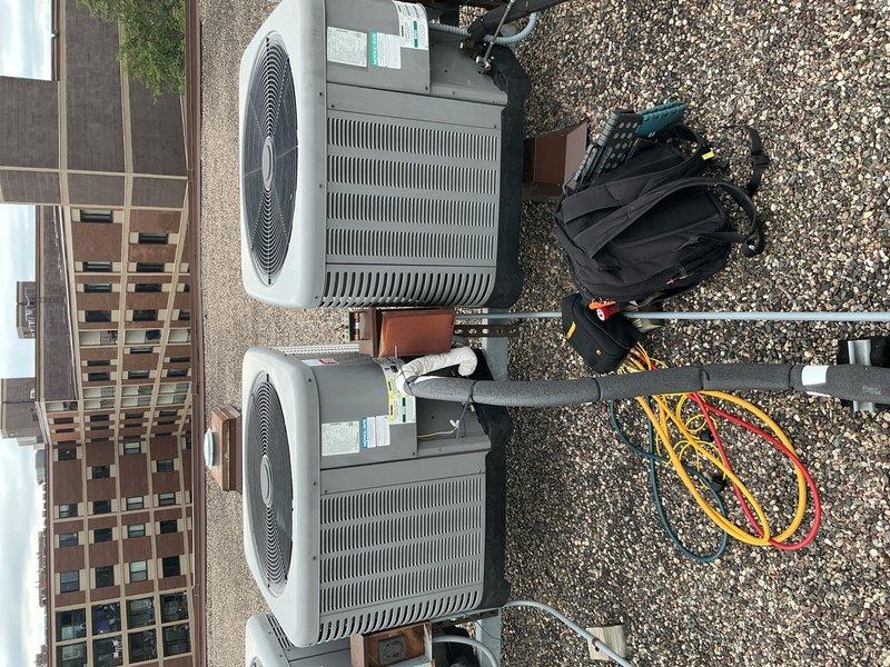 Completed comprehensive tune-up on two rooftop air conditioning systems, both approximately 5-6 years old and operating within normal parameters. Accessed rooftop units via front desk key coordination. Replaced two 20x20x1 air filters in the air handler compartment. Performed full inspection of indoor components including blower motor speeds, evaporator coils, and ductwork connections—all found in satisfactory condition. Inspected both outdoor condenser units on rooftop, checking electrical wiring connections, capacitors, contactors, and refrigerant charge levels. All components tested within manufacturer specifications with no deficiencies noted. Both systems are fully operational and prepared for cooling season demands.