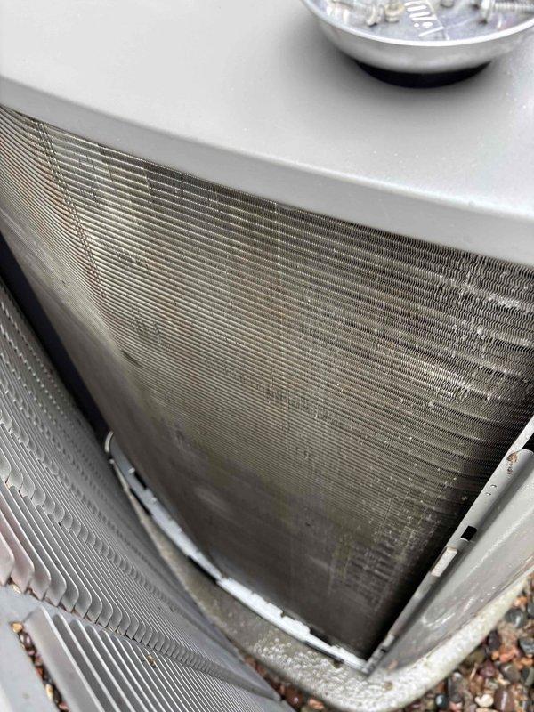 Performed comprehensive AC maintenance on one 3-year-old condenser unit utilizing R-410A refrigerant under 62-degree ambient conditions. Completed full system inspection including filter, thermostat operation, temperature split analysis, condenser coils, evaporator coils, blower motors, capacitors, compressor function, refrigerant charge level, and condensate drain line. During inspection, identified outdoor blower motor capacitor (10mfd) testing outside acceptable specifications, indicating potential failure risk. Replaced defective capacitor with OEM-equivalent component to restore proper motor operation and prevent system shutdown. Verified all system components operating within normal parameters following repair, with proper airflow, adequate refrigerant charge, and correct temperature differential across the evaporator coil. System returned to full operational status with all maintenance agreement requirements fulfilled.