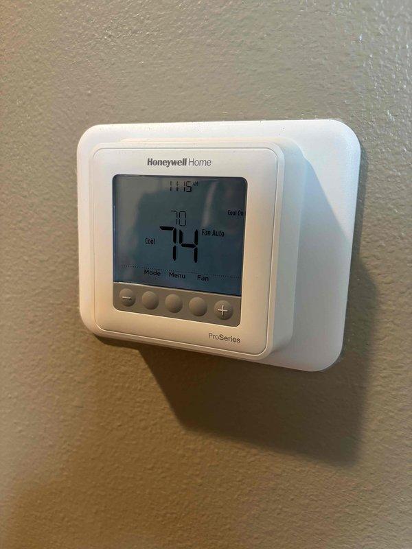 Performed comprehensive AC maintenance on one R-410A condensing unit with no reported issues. Conducted full system inspection including air filter, Honeywell thermostat operation, temperature split measurements, condenser coil condition, evaporator coil, blower motor, capacitor testing with multimeter, compressor amperage draw, refrigerant charge level, and condensate drain line. All components tested within normal operating parameters at 65-degree ambient temperature, and system is cooling properly.