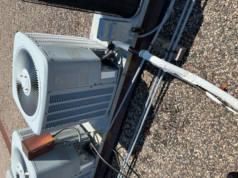 Completed comprehensive AC tune-up on rooftop unit, accessing system with key obtained from front desk. Replaced 20x20x1 air filter and verified blower speeds operating within normal parameters. Performed full inspection of rooftop condensing unit including capacitor, contactor, electrical wiring, and refrigerant levels—all components tested and confirmed in good working condition with no issues found.