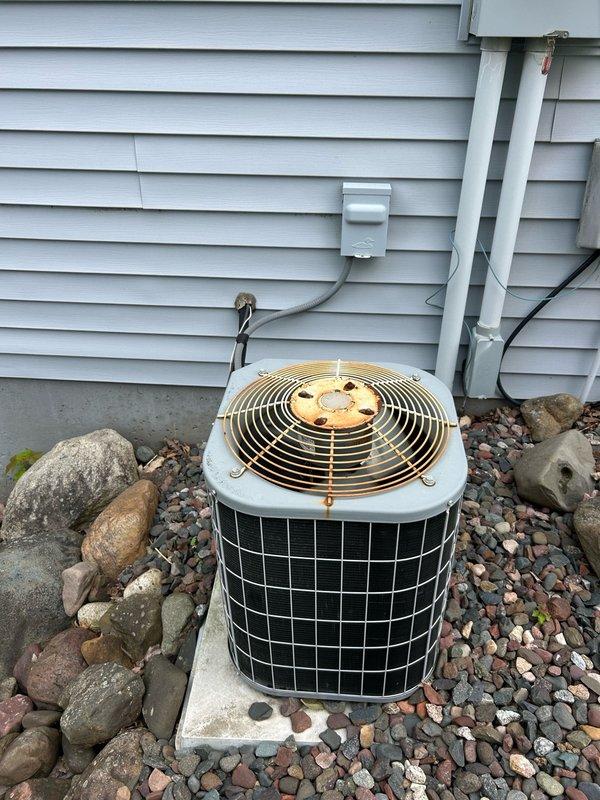 Performed comprehensive tune-up on a 22-year-old Carrier air conditioning system. Inspected indoor air handler, confirming clean air filter, balanced airflow, and proper supply/return temperature split. Verified condensate drain line operating correctly with no blockages. Evaluated outdoor condensing unit, testing refrigerant pressures and temperatures which were within manufacturer specifications. Measured capacitor, contactor, and compressor amperage draw, confirming all electrical and mechanical components functioning within normal operating parameters. Cleaned outdoor coil to maintain optimal heat transfer efficiency. System currently operating in normal working condition with no deficiencies noted.