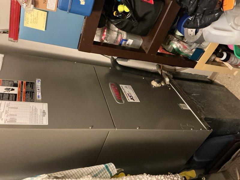 Completed comprehensive AC tune-up on 3-4 year old split system with rooftop condenser unit. Replaced 20x20x1 air filter at indoor air handler and verified blower motor speeds operating within normal parameters. Accessed rooftop unit and performed full inspection including capacitor testing, contactor evaluation, electrical wiring connections, and refrigerant charge verification—all components found in good working condition with no deficiencies noted. System operating properly with no repairs required.