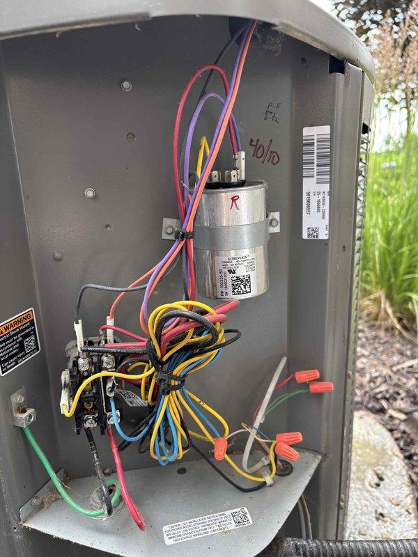Completed comprehensive AC maintenance on one condenser unit utilizing R-410A refrigerant with an ambient temperature of 69 degrees. Performed full system inspection including air filter, thermostat operation, temperature split measurements, condenser unit, evaporator and condenser coils, blower motor, run capacitor, compressor operation, refrigerant charge levels, and condensate drain line. All electrical components in the outdoor disconnect panel were inspected, including contactor and dual capacitor with proper wire connections verified. System tested and confirmed operating within normal parameters with no deficiencies noted at time of service completion.