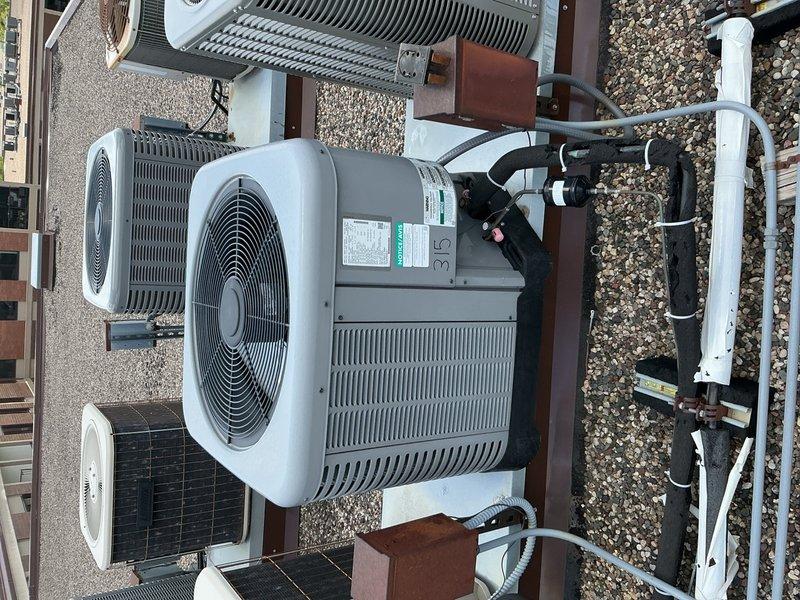 Completed comprehensive AC tune-up on 4-year-old rooftop unit accessed via front desk key. Performed full system inspection including 16x20x1 air filter evaluation, blower speed verification, capacitor testing with multimeter, contactor examination, electrical wiring inspection, and refrigerant level assessment. All components found operating within normal parameters with no deficiencies identified; system functioning properly.
