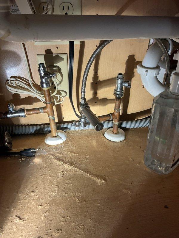 Responded to a water leak under the kitchen sink caused by a malfunctioning shut-off valve. After assessment, determined that capping the affected water line was the most appropriate solution rather than valve replacement. Successfully capped the leaking supply line and also capped an unnecessary refrigerator water line per customer preference. Verified all connections were secure and leak-free upon completion.