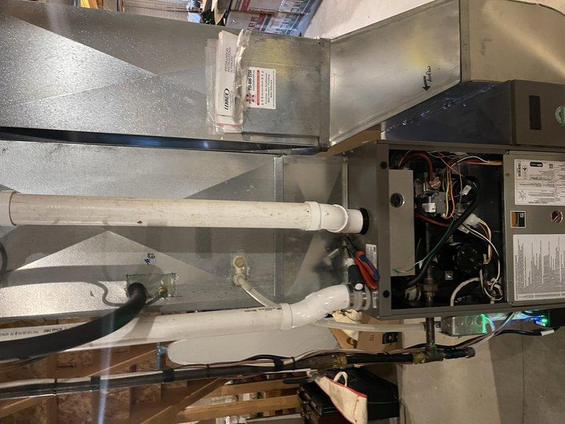 Completed comprehensive cooling system maintenance on residential air conditioning unit. Performed indoor inspection including furnace examination, air filter assessment, and temperature differential measurement confirming optimal 21-degree split across the evaporator coil. Conducted outdoor condenser service including full disassembly, coil cleaning, capacitor testing, and refrigerant pressure verification. Unit operational since 1994 continues to function within acceptable parameters. Noted condenser fan motor exhibiting oil seepage, indicating bearing wear consistent with equipment age; motor remains functional but approaching end of service life. All maintenance tasks completed per preventive maintenance protocol with system operating properly at time of departure.