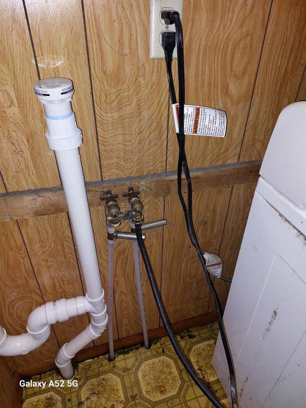 Responded to water leak at washing machine hookups where a recently installed shutoff switch was not fully closing, requiring the hot water supply to be shut off at the source to stop the leak. Upon inspection, determined the washing machine shutoff valve body was defective and leaking. Removed the faulty valve body assembly and installed new hose bibs for the washing machine connections, restoring proper water shutoff functionality and eliminating the leak.
