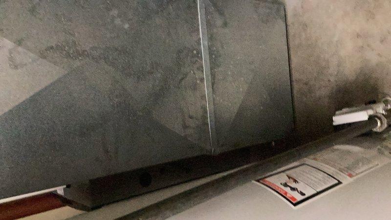 Responded to callback for reported gas odor following water heater gas valve replacement. Upon inspection, identified gas leak at connection point between gas supply valve and pilot assembly. Tightened connection nut to seal leak and verified system integrity before departure.