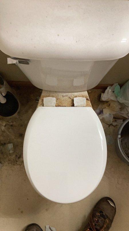 Completed comprehensive plumbing inspection for friends and family service call. Diagnosed non-functional garbage disposal in kitchen sink and provided three repair/replacement estimates for customer consideration. Inspected under-sink plumbing configuration including P-trap assembly, supply lines, and drain connections, documenting conditions with photographs. Also inspected bathroom toilet installation, noting leveling shims and general fixture condition.