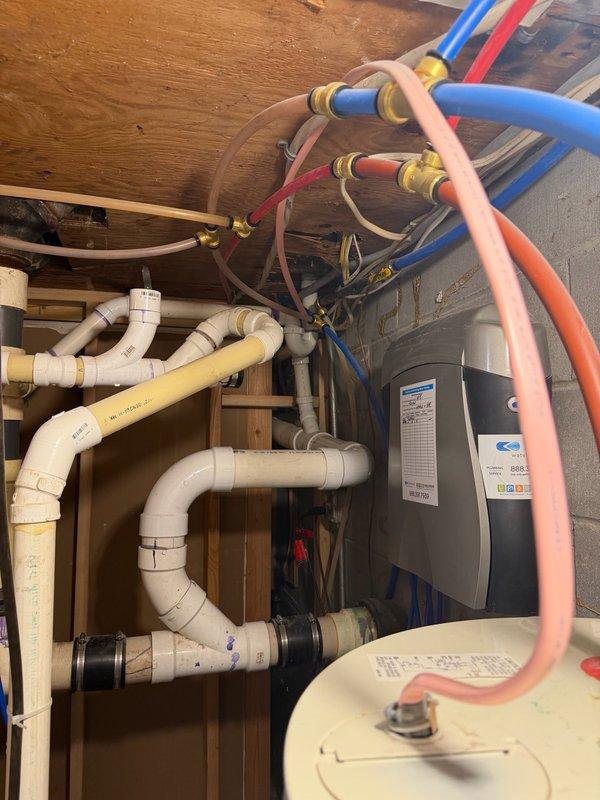 Responded to shower/tub drain issue with waste water odor concerns. Upon inspection, determined that installing a trap in the proposed location would not resolve the problem and would violate plumbing code requirements. Assessed the existing drain configuration and identified inadequate pipe sizing and lack of proper venting as root causes of the odor issue. Provided estimate for compliant repair solution including increasing pipe diameter, opening drywall section to install code-compliant trap beneath shower pan, and adding proper vent stack to eliminate sewer gas infiltration. Additionally identified non-compliant washing machine drain line installation and provided separate estimate for bringing system up to code standards.