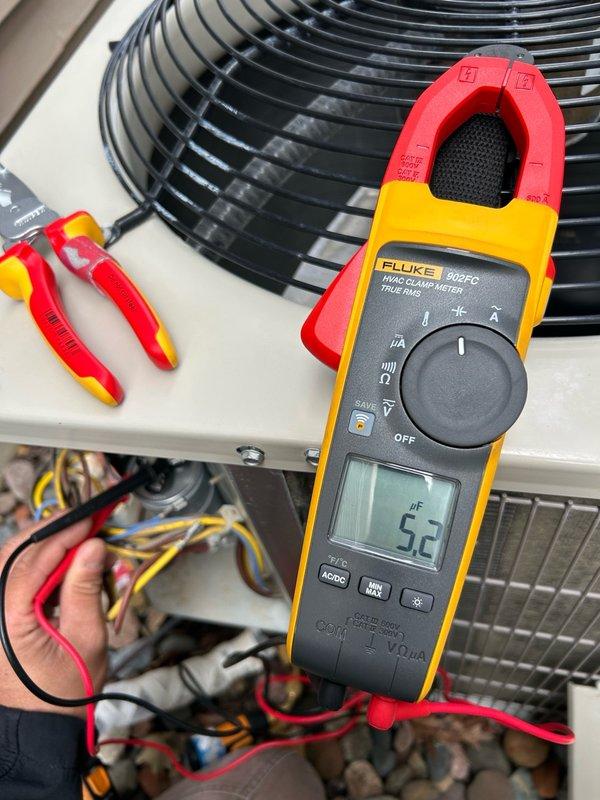 Completed comprehensive AC tune-up and maintenance inspection on 6-year-old residential air conditioning system. Verified and tested all major components including thermostat operation, air filter condition, blower assembly, outdoor condensing unit, electrical connections, contactor, capacitor, and condensate drain system. Measured condenser fan amperage at 5.2 amps using clamp meter, confirmed refrigerant charge and performance levels, and verified temperature split across evaporator coil. All operational parameters and electrical readings measured within manufacturer specifications with no mechanical defects, safety hazards, or performance issues identified. Outdoor coil and condenser unit found in clean condition with proper airflow. System operating at optimal efficiency with no immediate service needs or repairs required.