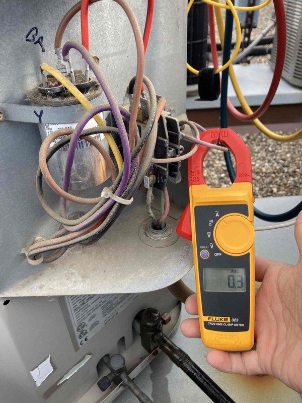 Performed comprehensive tune-up on rooftop air conditioning system. Tested capacitor functionality using multimeter, confirming proper microfarad readings within manufacturer specifications. Measured electrical amperage draw with clamp meter to verify compressor and system components operating at correct parameters. All system components inspected and found operating properly with no deficiencies noted.