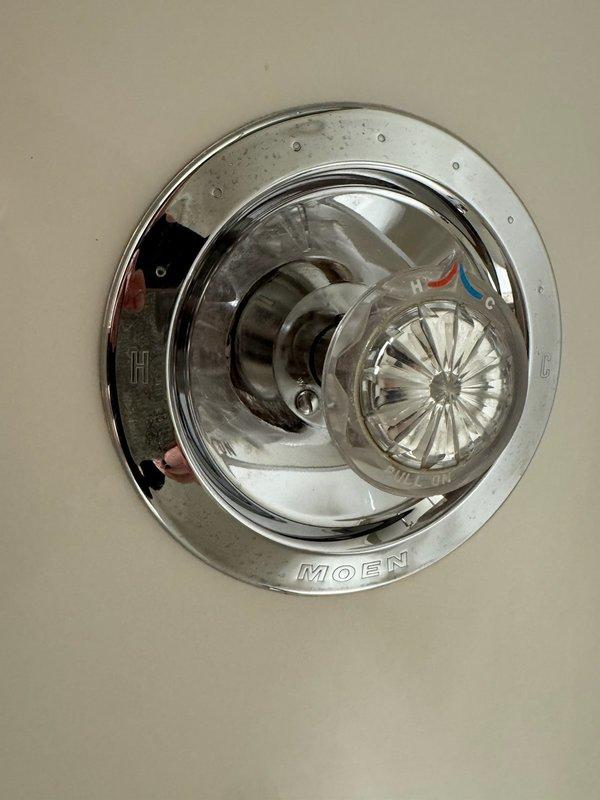 Responded to plumbing issue in basement bathroom where shower controls were failing due to age and possible corrosion. The existing Moen shower faucet was difficult to operate, with the handle requiring excessive force to pull. Diagnosed worn cartridge as the source of the problem. Replaced the Moen cartridge with new unit, restoring smooth operation to the shower valve. Tested hot and cold water flow to ensure proper function. Fixture now operates correctly with normal effort required for temperature and flow control.