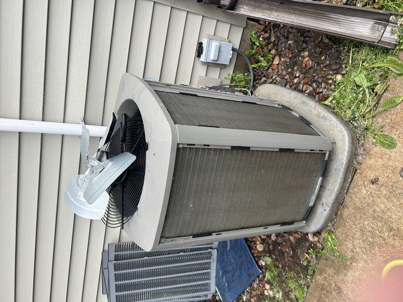 Performed comprehensive AC tune-up on 2-year-old system under maintenance agreement. Indoor furnace access was obstructed by stored items which required relocation to service equipment. Replaced air filter, cleared condensate drain line, and proceeded to outdoor unit where condenser coil was thoroughly cleaned. Inspected all electrical components and tested system operation. Unit is cooling properly and performing within normal parameters. Recommended more frequent air filter replacement to maintain optimal system performance and prevent future airflow restrictions.