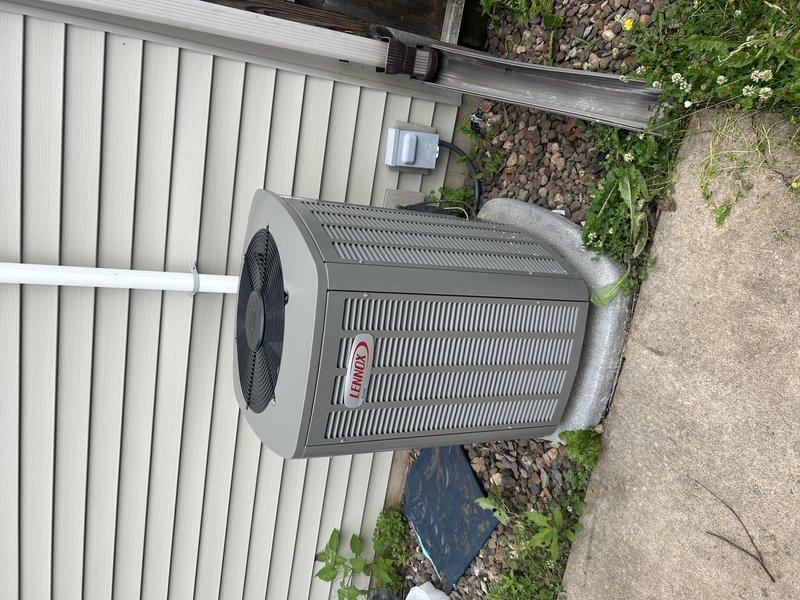 Performed comprehensive AC tune-up on 2-year-old system under maintenance agreement. Indoor furnace access was obstructed by stored items which required relocation to service equipment. Replaced air filter, cleared condensate drain line, and proceeded to outdoor unit where condenser coil was thoroughly cleaned. Inspected all electrical components and tested system operation. Unit is cooling properly and performing within normal parameters. Recommended more frequent air filter replacement to maintain optimal system performance and prevent future airflow restrictions.