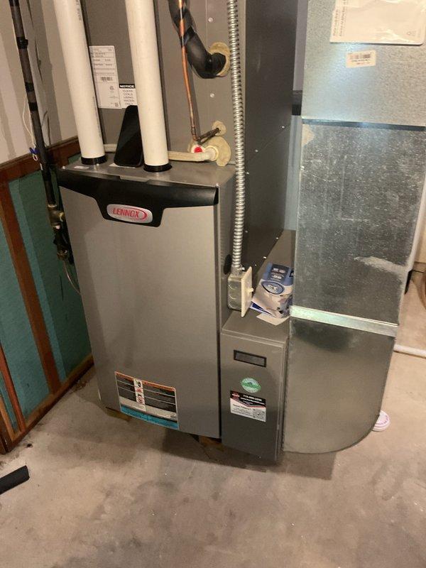 Completed comprehensive AC tune-up on residential system. Found outdoor condenser coil completely plugged with debris, performed thorough coil cleaning to restore proper airflow and heat transfer. Verified system operation with 14° temperature split at 800 CFM airflow, which is within acceptable parameters. Noted Y2 terminal not jumpered at unit with only two-wire thermostat connection present—system has operated satisfactorily for four years in current configuration, so no modifications were made to avoid potential issues during peak cooling season. Completed all standard maintenance procedures and confirmed proper system operation.