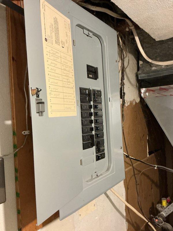 Responded to no-cooling complaint on 10-year-old air conditioning system experiencing buzzing noise at outdoor unit and causing voltage sag affecting other household equipment. Diagnosed failed capacitor on outdoor condensing unit preventing compressor and condenser fan operation. Replaced defective capacitor, installed hard start kit to assist with compressor startup, and performed condenser coil cleaning to restore proper airflow and heat transfer. System tested and verified operational with 21-degree temperature split across evaporator coil, confirming proper cooling capacity restored.