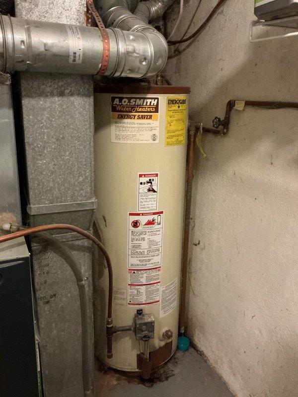 Responded to no-cooling complaint on 10-year-old air conditioning system experiencing buzzing noise at outdoor unit and causing voltage sag affecting other household equipment. Diagnosed failed capacitor on outdoor condensing unit preventing compressor and condenser fan operation. Replaced defective capacitor, installed hard start kit to assist with compressor startup, and performed condenser coil cleaning to restore proper airflow and heat transfer. System tested and verified operational with 21-degree temperature split across evaporator coil, confirming proper cooling capacity restored.