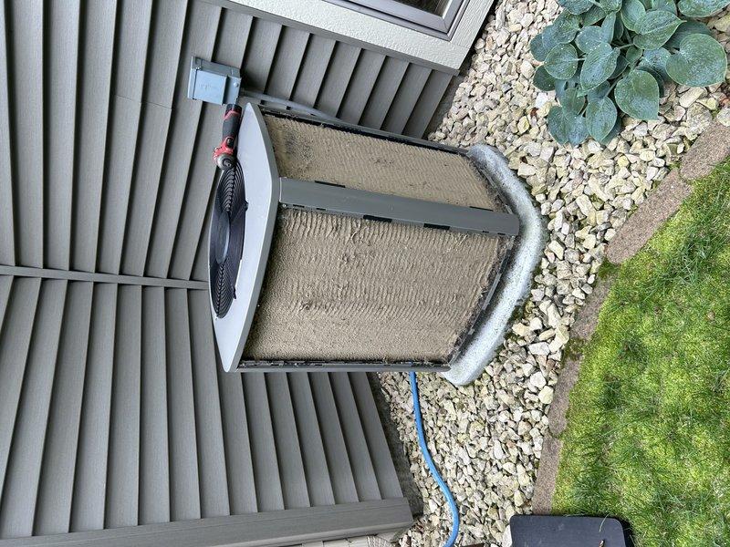 Completed comprehensive air conditioning tune-up and maintenance service. Tested system operation and confirmed proper cooling performance with good temperature drop in basement zone. Inspected air filter and verified clean condition. Cleared condensate drain line to ensure proper drainage and prevent water backup. Proceeded to outdoor unit where condenser coil was thoroughly washed to remove accumulated dust and debris from heat exchanger fins. Inspected all exterior components including fan assembly, refrigerant lines, and electrical connections for proper operation and condition. Unit is operating efficiently with all systems functioning within normal parameters.