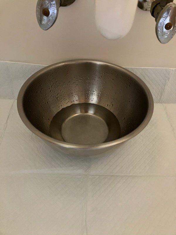 Responded to a water leak underneath the bathroom sink caused by a faulty supply line on the existing faucet. Upon inspection, determined the supply line leak was not repairable. Removed the old faucet assembly and installed a customer-supplied bathroom faucet with a metallic vessel sink design. Connected new supply lines using compression fittings, secured plumbing connections, and performed a thorough leak check of all connections. No leaks were detected upon completion of the installation.