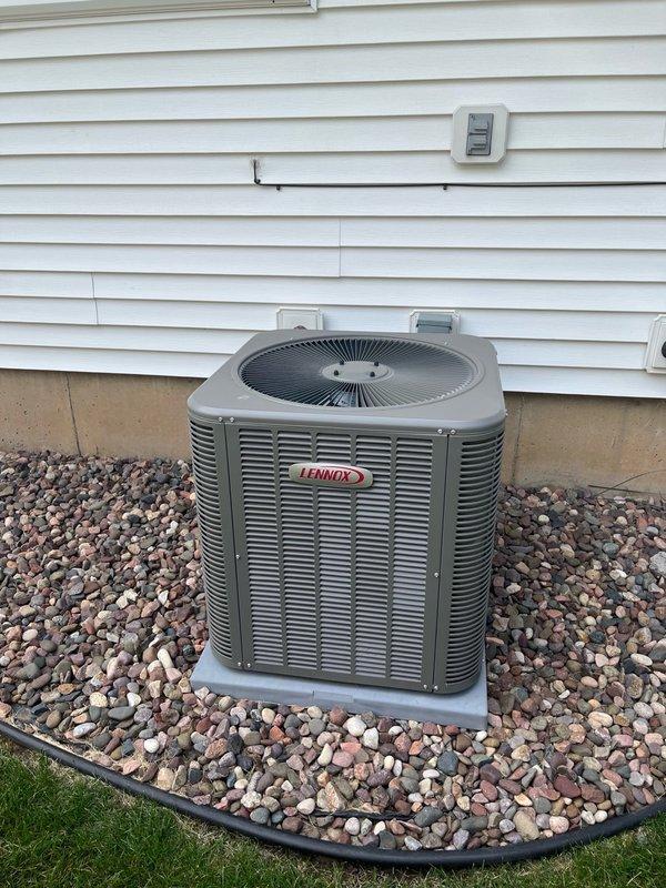 Completed comprehensive air conditioning tune-up and maintenance on residential Lennox condenser unit. Inspected air filter which had been recently replaced by homeowner. Verified blower assembly and evaporator coil were clean with proper condensate drainage. Performed electrical testing on outdoor unit including voltage and amperage readings, cleaned condenser coil, and verified proper operation of all components. System ran for 15 minutes during final testing, achieving 20-degree temperature split across the coil, confirming optimal cooling performance. All equipment operating within manufacturer specifications with no deficiencies noted.
