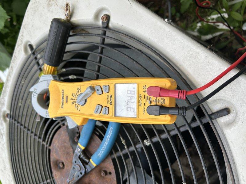 Responded to no cooling complaint on 22-year-old central air conditioning system. Upon arrival, verified outdoor unit fan motor operational and indoor blower assembly functioning normally. Performed system diagnostics and pressure testing, which revealed system was essentially flat on R-22 refrigerant, indicating significant refrigerant leak. Conducted visual inspection of refrigerant lines and coil assemblies to identify potential leak sources. Provided customer with comprehensive pricing options for leak detection, repair, and recharge services. Coordinated scheduling with service advisor for follow-up appointment to perform leak repair once customer approves estimate. System currently inoperable due to insufficient refrigerant charge.