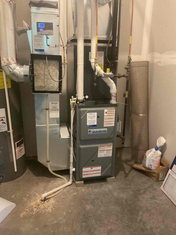 Responded to service call for non-functioning air conditioning system. Performed comprehensive 12-point AC tune-up on Daikin HVAC system including indoor air handler and outdoor condenser unit. Inspected all system components, verified refrigerant levels, tested electrical connections, examined condensate drainage, and confirmed proper airflow throughout the system. All equipment found to be operating within manufacturer specifications with no issues identified. System restored to normal operation with thermostat responding correctly to temperature setpoint adjustments.