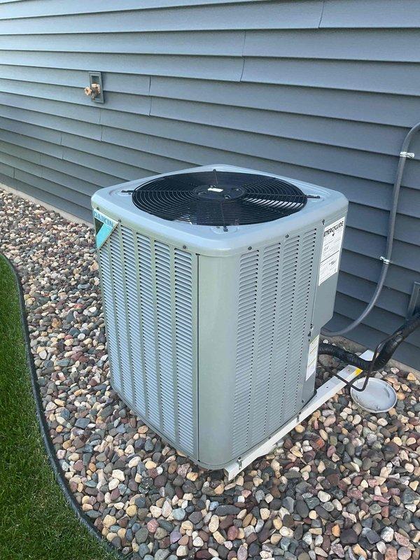 Responded to service call for non-functioning air conditioning system. Performed comprehensive 12-point AC tune-up on Daikin HVAC system including indoor air handler and outdoor condenser unit. Inspected all system components, verified refrigerant levels, tested electrical connections, examined condensate drainage, and confirmed proper airflow throughout the system. All equipment found to be operating within manufacturer specifications with no issues identified. System restored to normal operation with thermostat responding correctly to temperature setpoint adjustments.