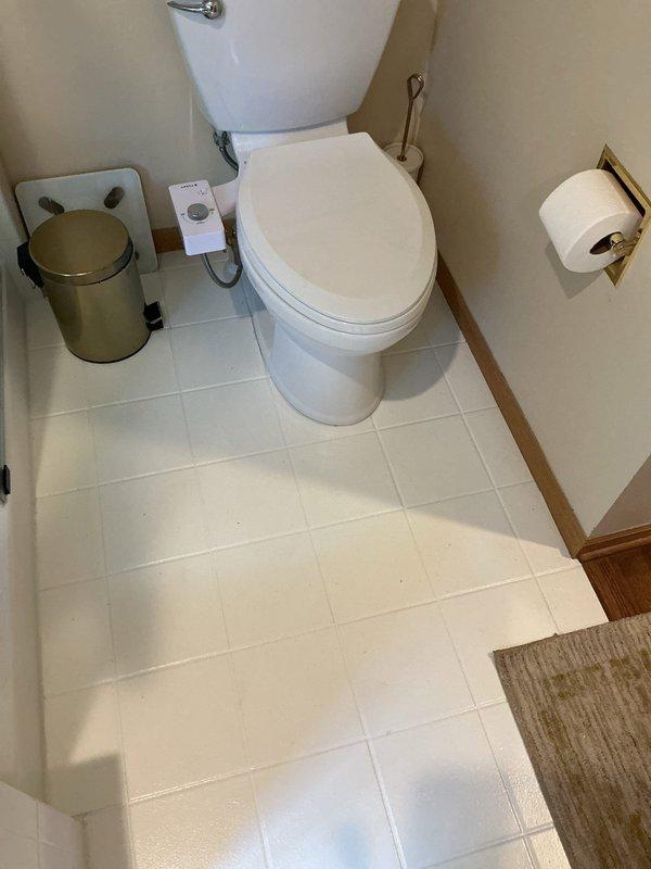 Responded to a leaking and unstable toilet that had been improperly installed with excessive shimming. Upon inspection, found the fixture had been secured with 10 shims when none were required. Removed all unnecessary shims, properly reset the toilet to ensure level installation and secure mounting, and verified elimination of leak. Toilet now sits flush against the floor with proper seal and stability restored.