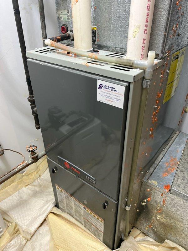 Responded to service call for air conditioning system running continuously and not maintaining temperature. Upon arrival, inspected system and found outdoor condenser unit heavily soiled with debris accumulation on coil surfaces. Performed exterior coil cleaning by rinsing condenser unit to remove dirt and debris buildup. Conducted refrigerant pressure diagnostics and identified significantly low R22 refrigerant charge, indicating system leak. Documented findings including aged equipment condition, corroded fan assembly, and compromised refrigerant levels. Advised property owner that system requires leak detection and repair services, and recommended obtaining repair estimates to evaluate cost-effectiveness given equipment age and R22 refrigerant phase-out considerations. Coordinated follow-up appointment with comfort advisor for comprehensive system evaluation and replacement options discussion.