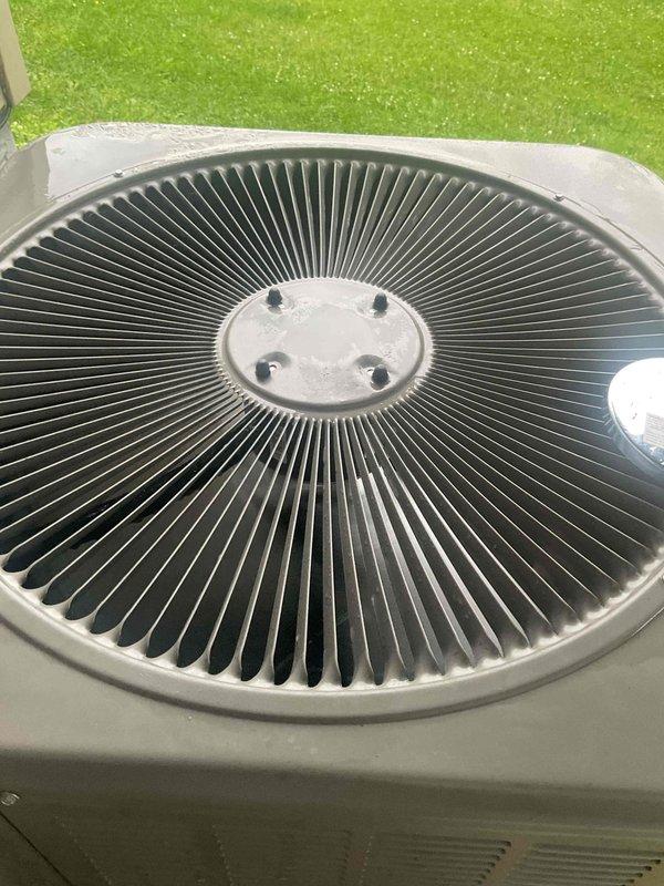 Responded to no-cooling complaint on 8-12 SEER AC system installed within past year. Diagnosed issue as load control receiver (energy saver box) from electric utility preventing unit operation. Bypassed load control device to restore immediate cooling functionality. Customer advised to contact Pierce Cooperative Services electrical company regarding load control receiver interference with AC operation.