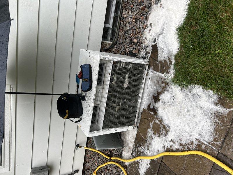 Responded to no-cooling complaint on approximately 40-year-old system experiencing ice buildup and freezing conditions. Upon inspection, found air filters and blower wheel relatively clean, but condenser unit required thorough cleaning before accurate diagnostics could be performed. After cleaning condenser coils and components, conducted refrigerant charge analysis which revealed abnormally low suction pressure and elevated superheat readings, confirming significant refrigerant undercharge. Provided system recharge options and scheduled follow-up consultation to discuss repair versus replacement recommendations given the age and condition of the equipment.