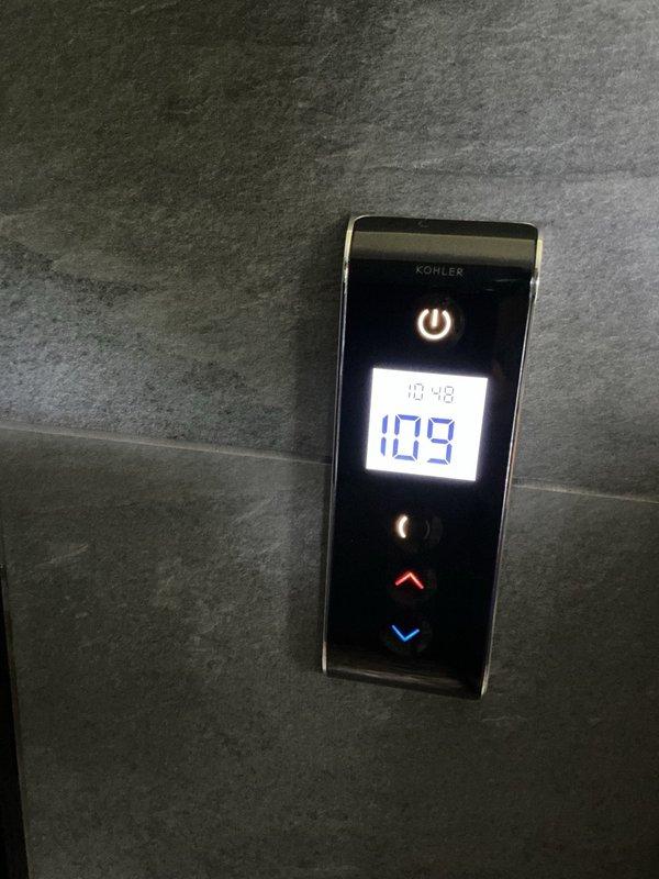 Installed customer-supplied Kohler thermistor component for electronic shower system. Replaced faulty part, restored water supply, and verified proper temperature control operation through digital interface panel, confirming accurate temperature adjustment functionality.