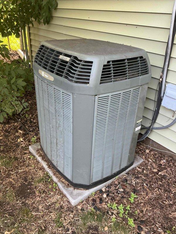 Responded to no cooling complaint on 20-year-old Trane air conditioning system with reported breaker tripping issues. Upon arrival, system was operational and residence was at comfortable temperature. Performed diagnostic testing and found compressor drawing near maximum rated amperage, indicating potential compressor failure or internal mechanical seizure. Inspection revealed previous rodent damage to wiring with documented history of high voltage shorts from mice chewing electrical connections, which may have compromised compressor windings and contributed to current electrical issues. Visual inspection of condenser coil showed moderate dirt accumulation affecting heat transfer efficiency. Discussed repair versus replacement options given unit age, recurring service history, and compressor condition. Coordinated follow-up appointment with service advisor to review comprehensive solutions and provide estimate for necessary repairs or system replacement.