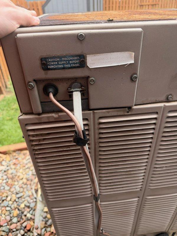 Responded to no-cooling complaint on residential split system with approximately 40-year-old General Electric Weathertron outdoor unit. Upon inspection, found severely restricted airflow due to plugged A-coil, failed blower motor with oil leakage contaminating internal components, and cracked heat exchanger presenting safety concern. Discussed findings and system condition with homeowner, including age-related equipment failure and safety issues. Coordinated comfort advisor consultation for system replacement recommendations given extensive component failures and advanced age of equipment beyond economical repair.