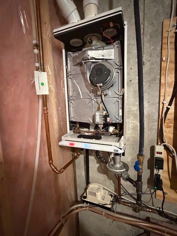 Responded to no hot water complaint on tankless water heater unit. Upon inspection, diagnosed faulty IBC SFT 199 control board causing system failure. Removed defective board and installed warranty replacement IBC SFT 199 board. Reconnected all electrical connections and wiring harnesses to new control board. Powered up unit and performed operational testing of all functions including ignition sequence, burner operation, and temperature control. Verified proper communication between control board and system components. Confirmed hot water delivery throughout home and unit operating within manufacturer specifications.