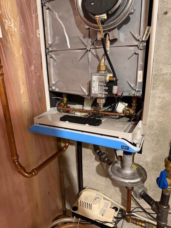 Responded to no hot water complaint on tankless water heater unit. Upon inspection, diagnosed faulty IBC SFT 199 control board causing system failure. Removed defective board and installed warranty replacement IBC SFT 199 board. Reconnected all electrical connections and wiring harnesses to new control board. Powered up unit and performed operational testing of all functions including ignition sequence, burner operation, and temperature control. Verified proper communication between control board and system components. Confirmed hot water delivery throughout home and unit operating within manufacturer specifications.