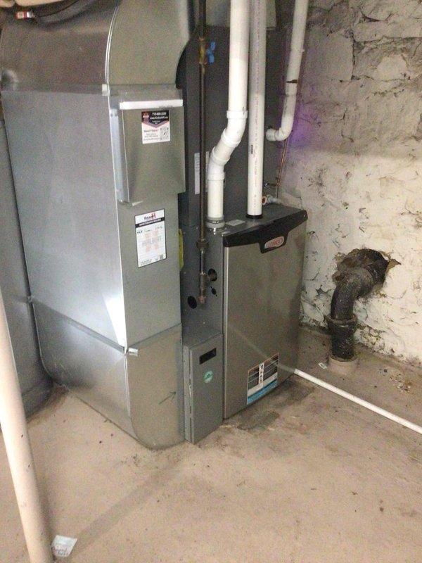 Responded to no cooling complaint on 2021 Lennox air conditioner displaying outdoor unit excessive inverter alarm code. Found outdoor unit airflow severely restricted by overgrown vegetation in direct contact with condenser coil and cabinet. Indoor air filter was heavily soiled, further restricting system airflow. Performed hard reset at breaker, after which unit resumed normal operation. Conducted electrical diagnostics including voltage surge testing and compressor winding resistance measurements—all readings within manufacturer specifications. Advised homeowner to immediately replace air filter and trim back vegetation minimum 24 inches from unit perimeter to maintain adequate airflow and prevent future inverter faults.