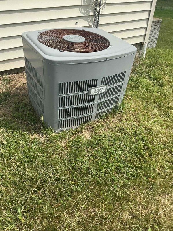 Responded to a no cooling call on a 24-year-old American Standard air conditioning system. Upon arrival, attempted to diagnose the AC unit but discovered the indoor furnace blower motor was completely seized and inoperative. Without airflow from the blower motor, unable to properly test or evaluate the air conditioning system's cooling performance or refrigerant circuit operation.

Conducted visual inspection of the furnace heat exchanger and identified significant corrosion present on the heat exchanger tubes at their connection points to the front panel of the furnace. The corrosion pattern indicates potential separation of the tubes, which presents a safety concern for future heating operation. Documented findings with photographs of both the outdoor condensing unit and the seized indoor blower motor assembly.

Explained to the customer that the seized blower motor must be addressed before any AC diagnostics can be completed, as the system requires proper airflow to safely operate a